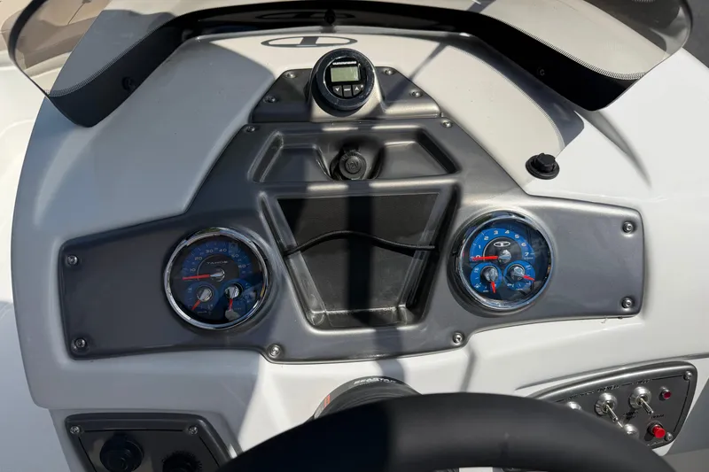 Slide: The Image of Dashboard of a 2026 Tahoe 1950 boat with gauges and controls. - 9