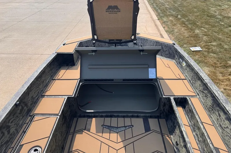 Slide: The Image of 2026 Tracker Grizzly 1756 T Marsh boat interior with open storage compartment. - 6