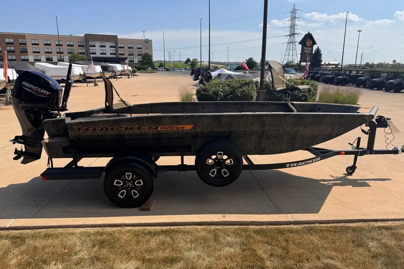 Slide: The Image of 2026 Tracker Grizzly 1756 T Marsh boat on trailer, outdoor setting. - 2