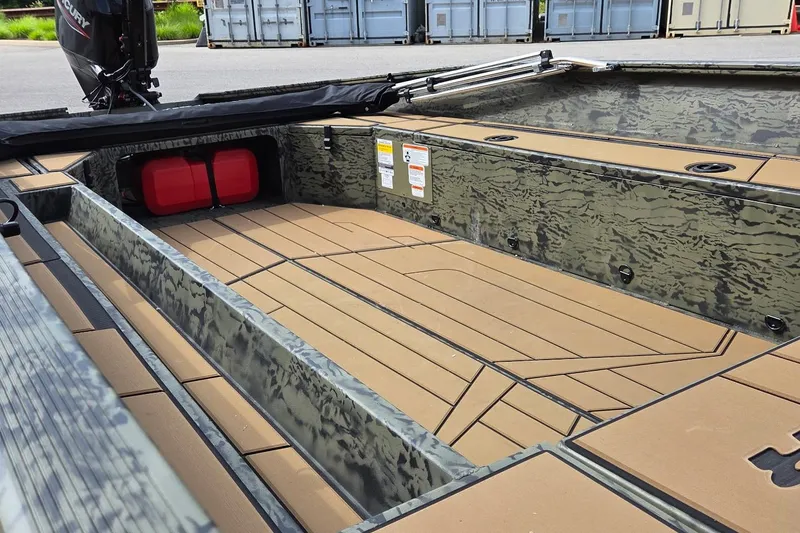 Slide: The Image of 2026 Tracker Grizzly 1756 T Marsh boat interior with camouflage design and spacious deck layout. - 3