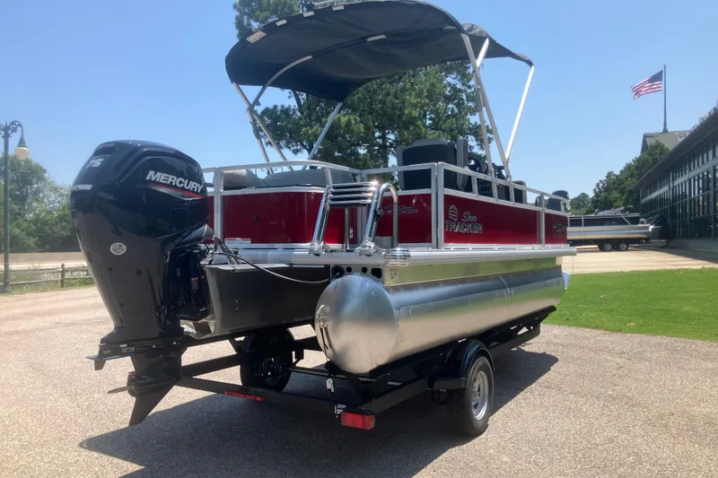 Slide: The Image of 2026 Sun Tracker Bass Buggy 18 DLX pontoon boat with Mercury engine on trailer. - 4