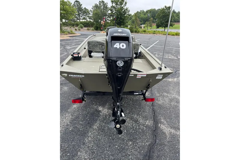 Slide: The Image of 2026 Tracker Grizzly 1754 SC boat with Mercury 40 engine in parking lot. - 6