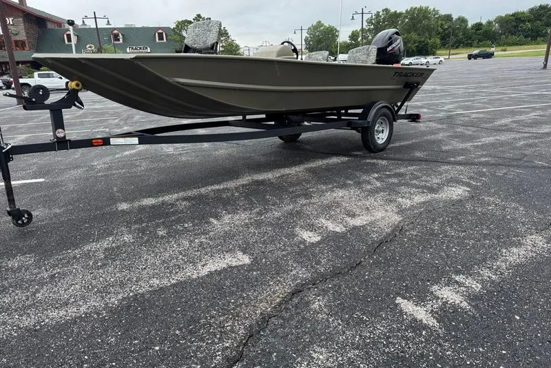 Slide: The Image of 2026 Tracker Grizzly 1754 SC boat on trailer in parking lot. - 4