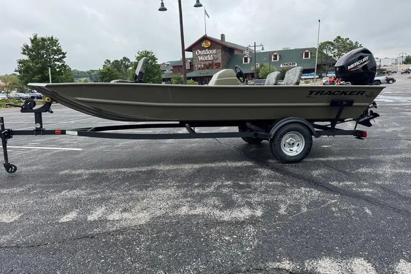 The Image of 2026 Tracker Grizzly 1754 SC boat on trailer in parking lot. - 0