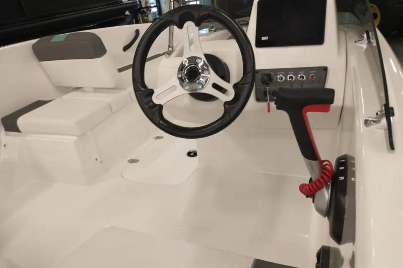 Slide: The Image of 2026 Tahoe T16 boat interior with steering wheel and control panel. - 6