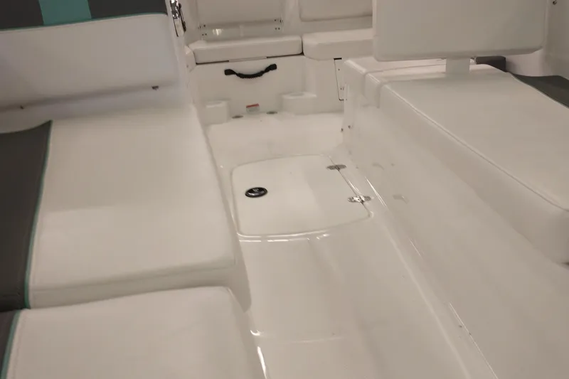 Slide: The Image of Interior seating of 2026 Tahoe T16 boat, featuring white and gray upholstery. - 7