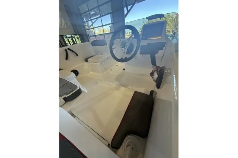 Slide: The Image of 2026 Tahoe T16 boat interior with steering wheel and control panel. - 6