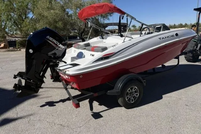 Slide: The Image of 2026 Tahoe T16 boat with red and white design, on trailer, featuring Mercury outboard motor. - 3