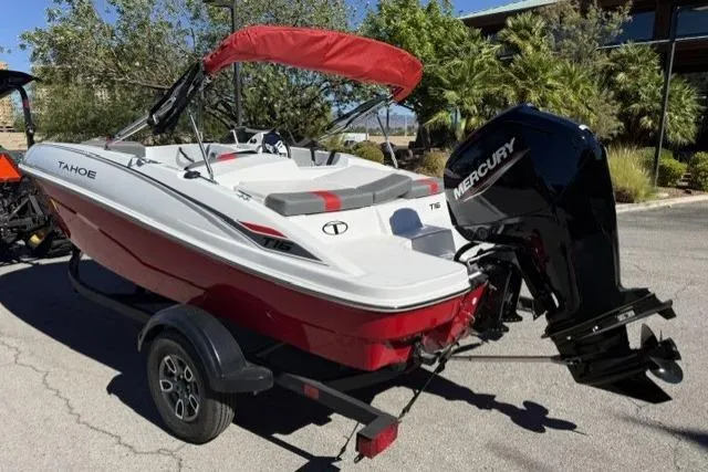 Slide: The Image of 2026 Tahoe T16 boat with Mercury engine on trailer, red and white design. - 4