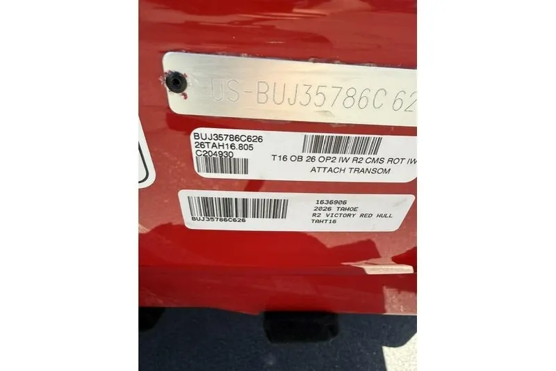 Slide: The Image of 2026 Tahoe T16 boat identification labels on a red hull. - 10