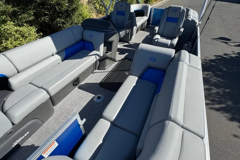 Slide: The Image of 2026 Sun Tracker Party Barge 22 XP3 interior with gray and blue seating. - 14