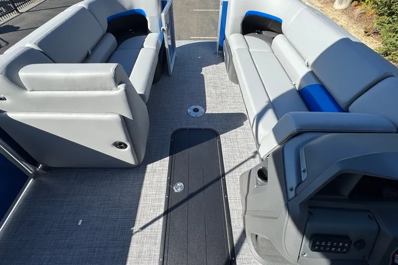 Slide: The Image of 2026 Sun Tracker Party Barge 22 XP3 interior with gray seating and modern design. - 13