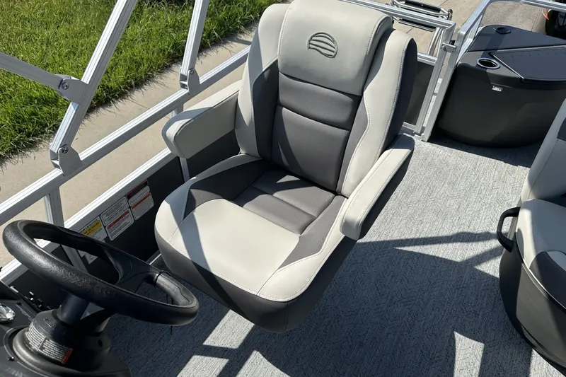 Slide: The Image of 2026 Sun Tracker Bass Buggy 18 DLX boat seat and steering wheel, featuring modern design. - 20