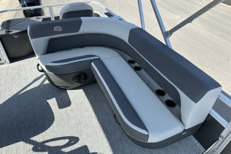 Slide: The Image of 2026 Sun Tracker Bass Buggy 18 DLX pontoon boat seating with cup holders and modern design. - 23