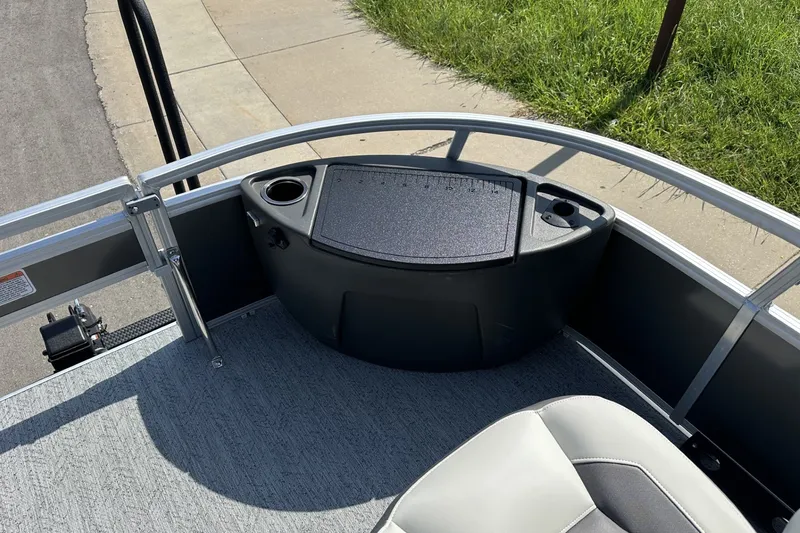 Slide: The Image of 2026 Sun Tracker Bass Buggy 18 DLX boat interior with seating and storage compartments. - 15