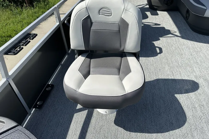 Slide: The Image of 2026 Sun Tracker Bass Buggy 18 DLX boat seat with gray and white upholstery. - 14