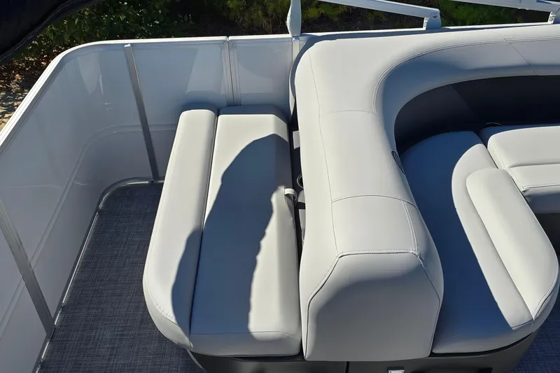Slide: The Image of 2026 Sun Tracker Party Barge 18 DLX with sleek gray seating and modern design. - 6