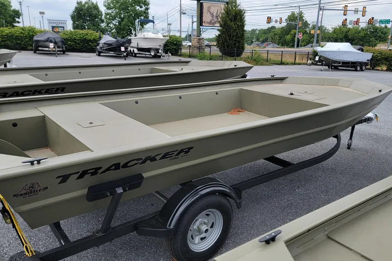 The Image of 2026 Tracker Grizzly 1754 Utility boat on trailer in outdoor lot. - 0
