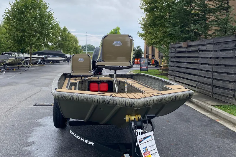 Slide: The Image of 2026 Tracker Grizzly 1756 T Marsh boat on trailer, parked outdoors. - 4