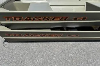The Image of 2026 Tracker Grizzly 14 Jon boat, side view with logo visible. - 0