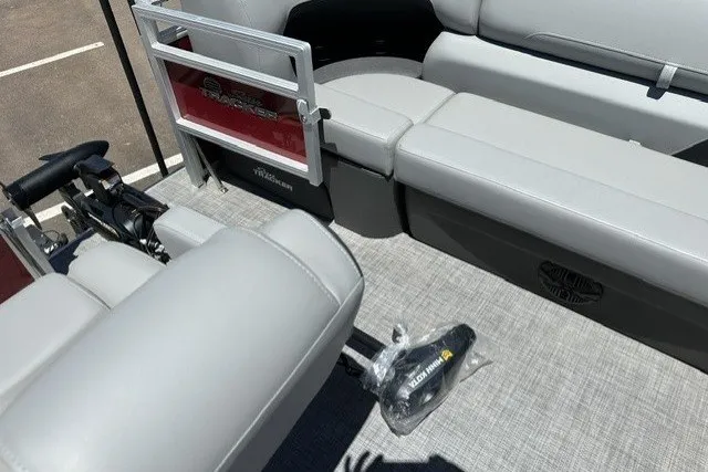 Slide: The Image of 2026 Sun Tracker SportFish 20 DLX interior with gray seating and fishing equipment. - 19