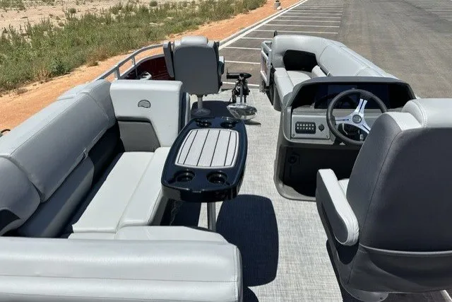 Slide: The Image of 2026 Sun Tracker SportFish 20 DLX pontoon boat with spacious seating and modern dashboard. - 17