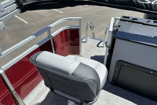 Slide: The Image of 2026 Sun Tracker SportFish 20 DLX boat interior with seating and railing. - 26