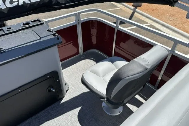 Slide: The Image of 2026 Sun Tracker SportFish 20 DLX boat interior with seating and console. - 21