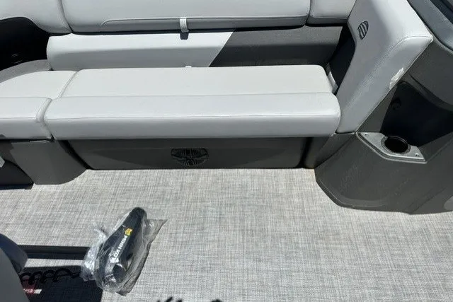 Slide: The Image of Sun Tracker SportFish 20 DLX 2026 boat interior with gray seating and flooring. - 23