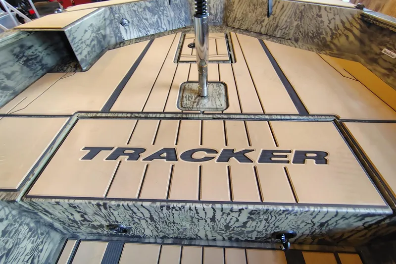Slide: The Image of 2026 Tracker Grizzly 1756 T Marsh boat deck with camo design and logo. - 12