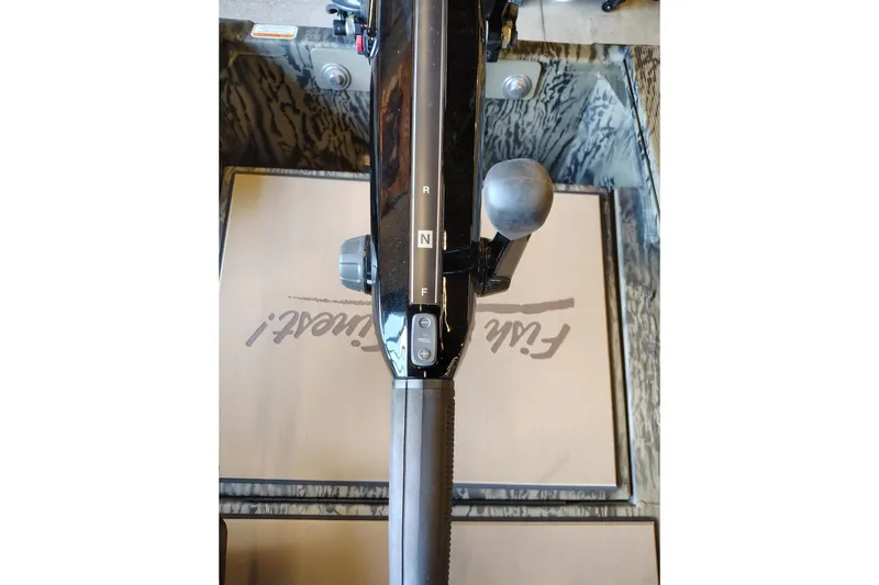 Slide: The Image of 2026 Tracker Grizzly 1756 T Marsh boat throttle control, featuring forward, neutral, and reverse settings. - 9