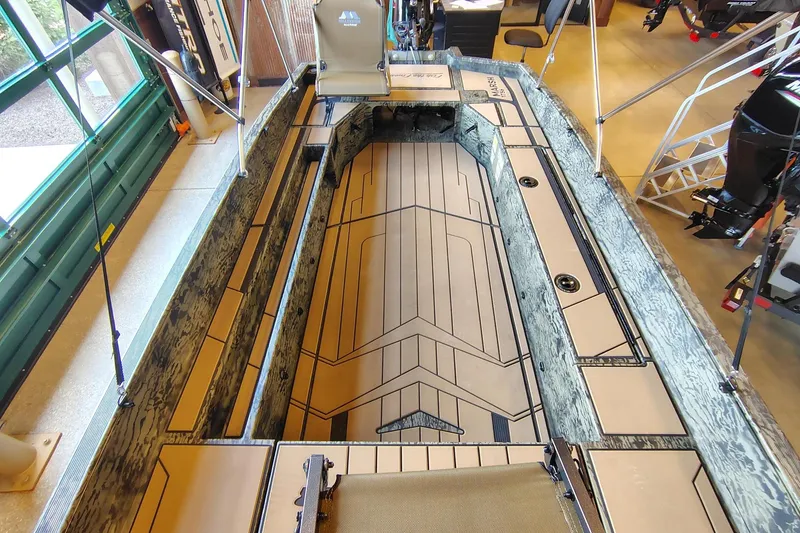Slide: The Image of 2026 Tracker Grizzly 1756 T Marsh boat interior with camouflage design and spacious layout. - 14
