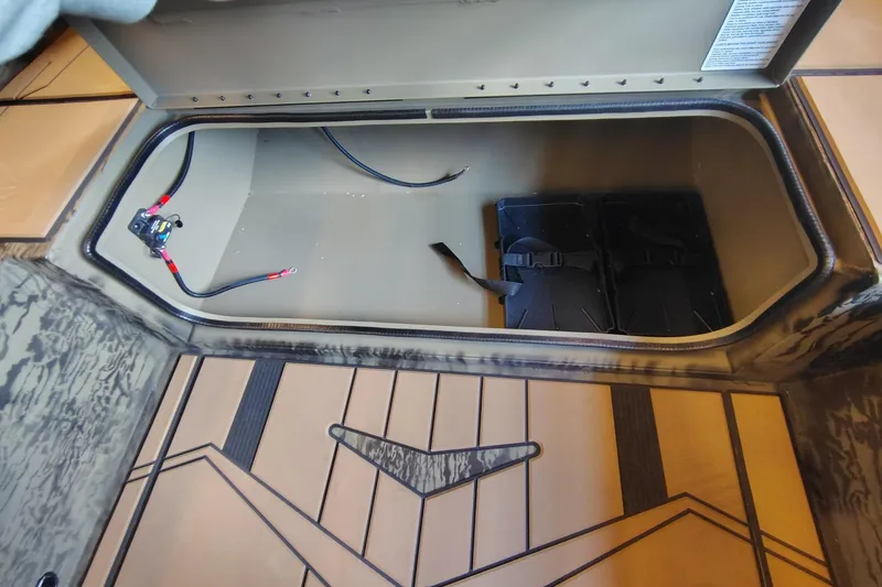 Slide: The Image of Open storage compartment in 2026 Tracker Grizzly 1756 T Marsh boat. - 4