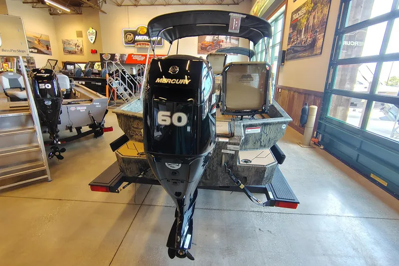 Slide: The Image of 2026 Tracker Grizzly 1756 T Marsh boat with Mercury 60 engine in showroom. - 3