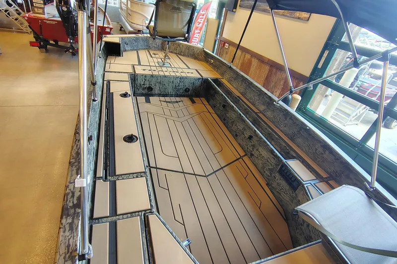 Slide: The Image of 2026 Tracker Grizzly 1756 T Marsh boat interior with spacious deck and seating. - 13