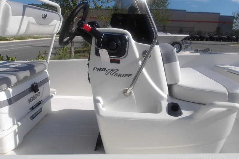 Slide: The Image of 2026 Mako Pro Skiff 17 CC boat interior with steering console and seating. - 7