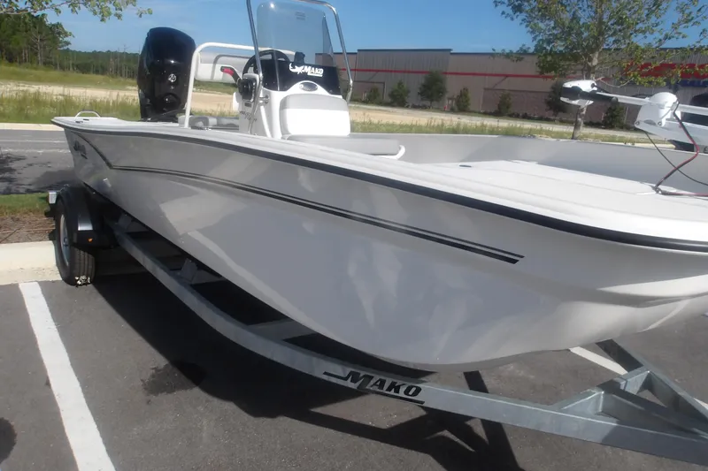 Slide: The Image of 2026 Mako Pro Skiff 17 CC boat on trailer in parking lot. - 5