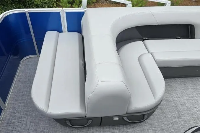 Slide: The Image of 2026 Sun Tracker Party Barge 18 DLX with gray seating and blue paneling. - 8