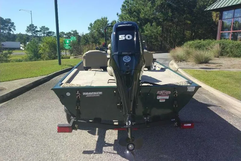 Slide: The Image of 2026 Tracker Bass Tracker Classic Limited boat with Mercury 50 engine on trailer. - 18