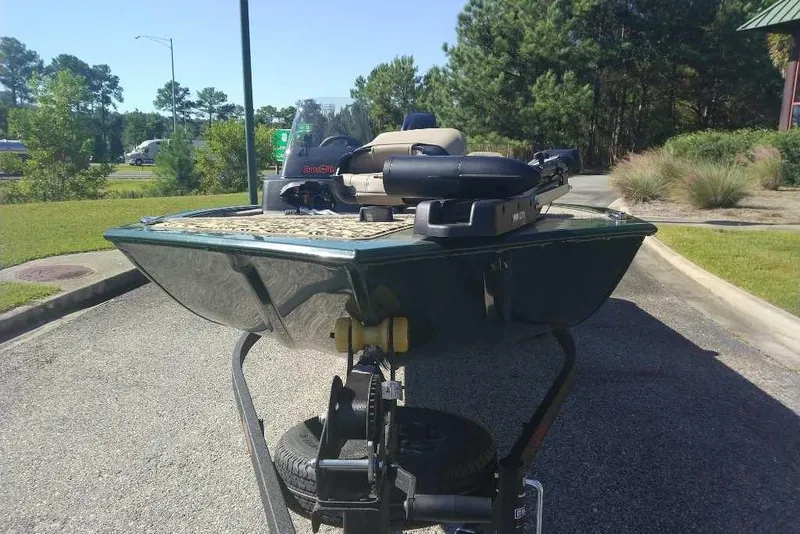 Slide: The Image of 2026 Tracker Bass Tracker Classic Limited boat on trailer, parked outdoors. - 19