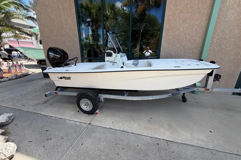The Image of 2026 Mako Pro Skiff 13 CC boat on trailer, displayed outdoors. - 0