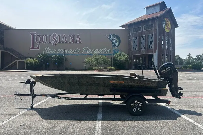 Slide: The Image of 2026 Tracker Grizzly 1756 T Marsh boat in front of Louisiana Sportsman's Paradise. - 2