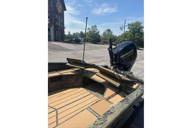 Slide: The Image of 2026 Tracker Grizzly 1756 T Marsh boat with Mercury engine in parking lot. - 6