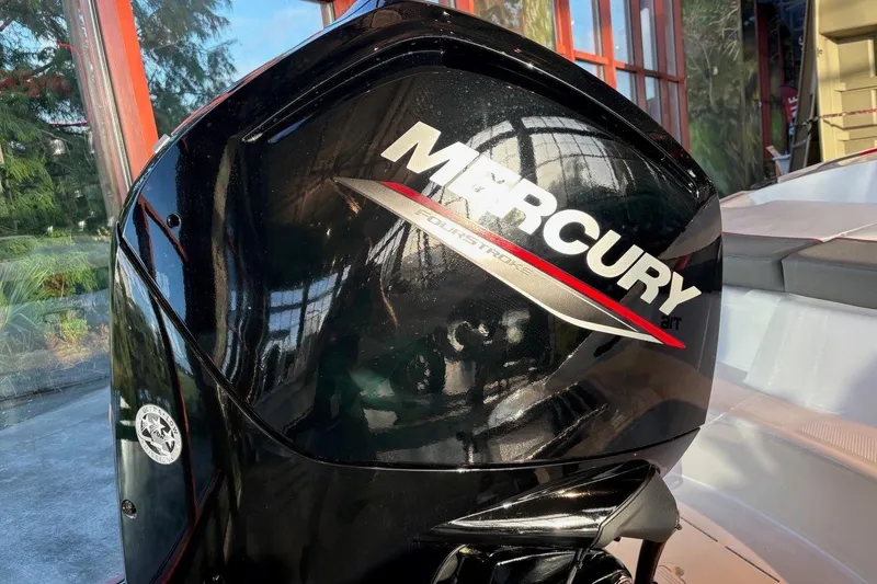 Slide: The Image of 2026 Tahoe T16 boat with Mercury FourStroke engine, displayed indoors. - 15