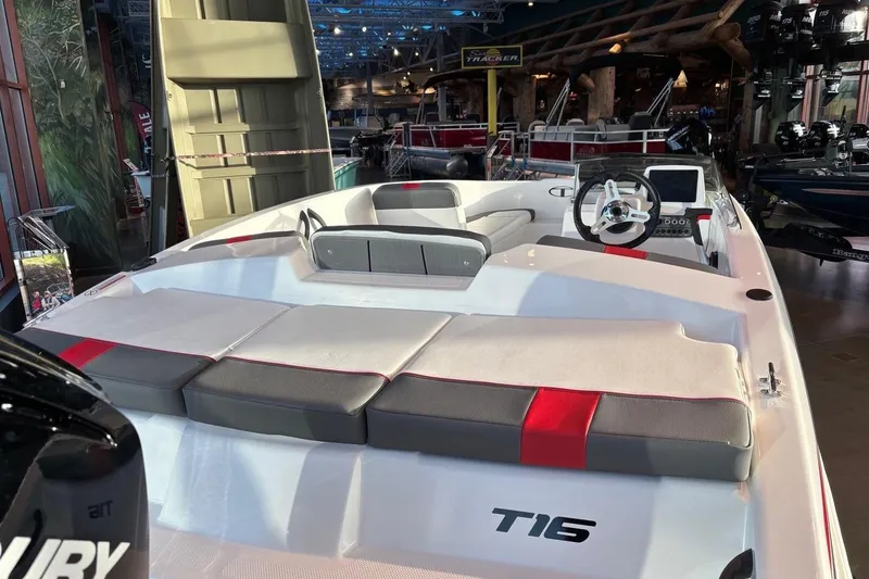 Slide: The Image of 2026 Tahoe T16 boat interior with cushioned seating and modern steering console. - 7