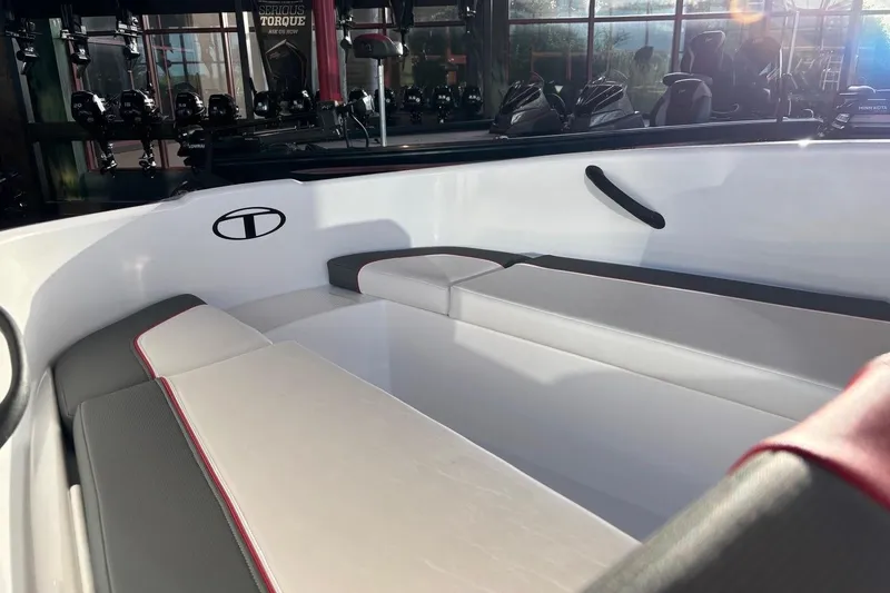 Slide: The Image of 2026 Tahoe T16 boat interior with sleek white and gray seating, modern design. - 10