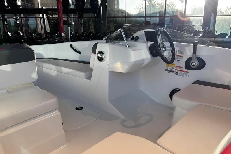 Slide: The Image of Interior of 2026 Tahoe T16 boat with seating and steering wheel. - 11