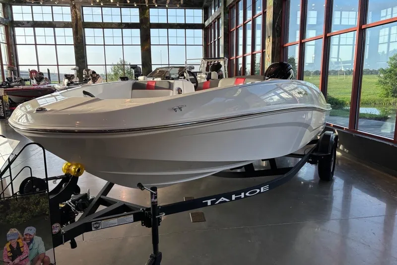 The Image of 2026 Tahoe T16 boat displayed indoors with large windows and natural lighting. - 0