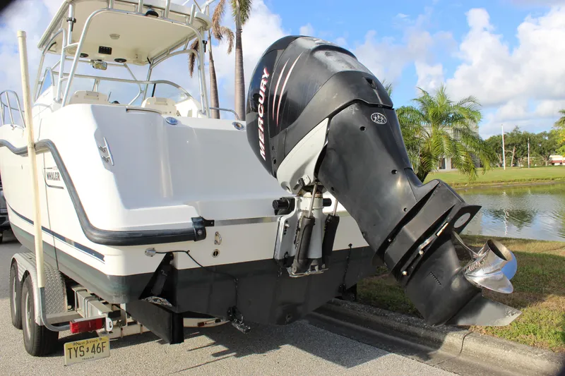 Slide: The Image of 2005 Boston Whaler 255 Conquest boat with Mercury outboard motor on trailer. - 10