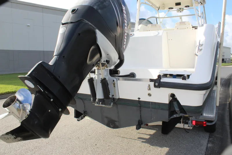 Slide: The Image of 2005 Boston Whaler 255 Conquest boat with Mercury outboard motor, rear view. - 16